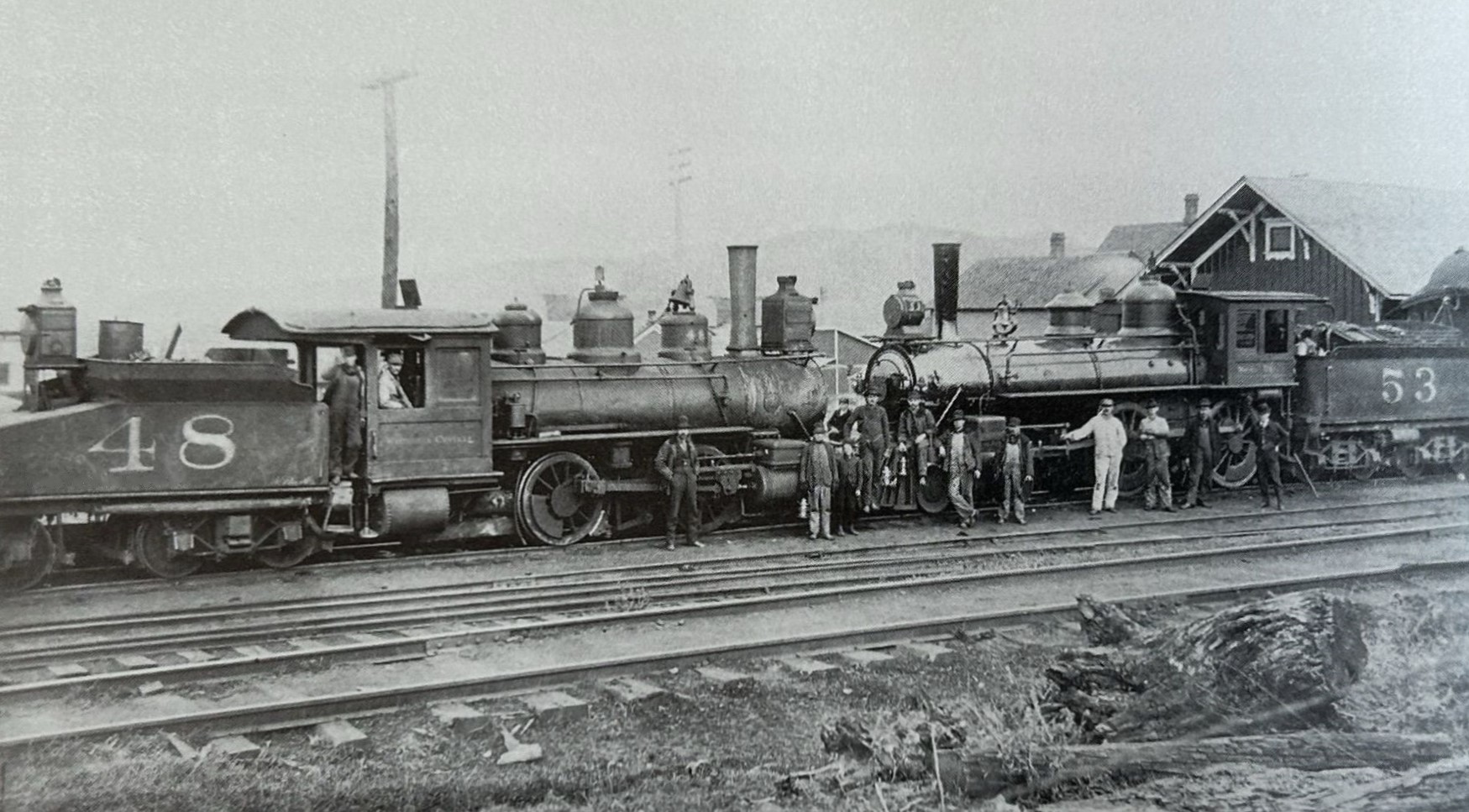 Two trains pose at Bessemer depot